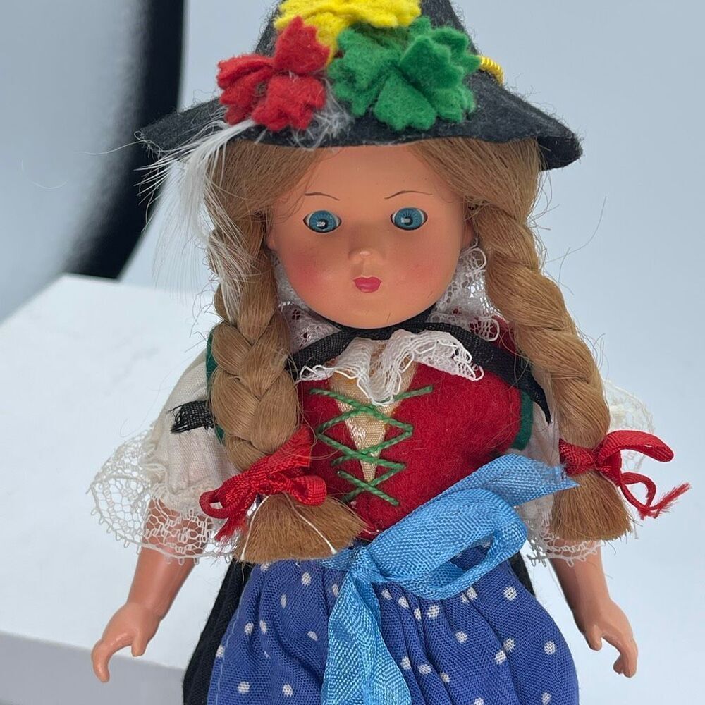 VTG 1950’s Austrian celluloid face blinking 9” doll.